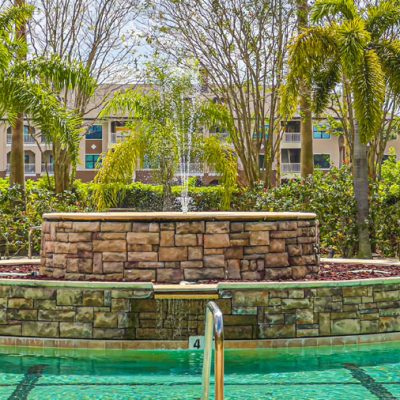 Interior pool fountain in community pool at Three Fountains of Viera Condominiums in Melbourne, Florida