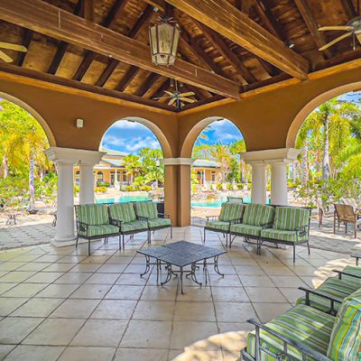 Outdoor seating area and pool at Three Fountains of Viera Condominiums in Melbourne, Florida